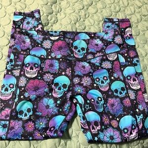 CVG leggings purple and teal skulls